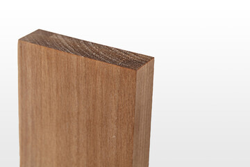 Three pieces of wood exhibiting distinct shades and grain patterns are stacked on a light background, ideal for crafting and design purposes in woodworking.