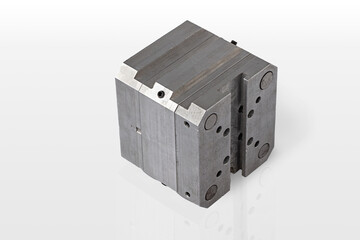 A detailed metal component is displayed prominently on a clean, white surface.