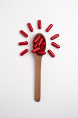 Red Capsule Tablet Medicine.Taking vitamins or medications. Concept of healthcare, medicine, pharmacy, disease prevention  