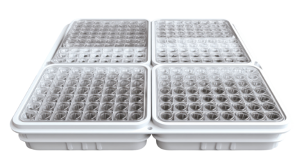 Four square, white trays, filled with clear, cylindrical wells