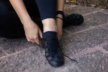 Lacing laces shoes for Irish dance on the floor