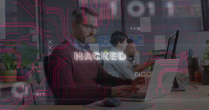 Typing sweater-clad man at office desk, with laptops, plants, neon circuit overlay, copy space