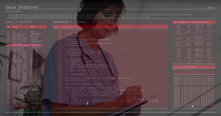 Standing medical professional reviewing code overlay in office, with tablet device and stethoscope