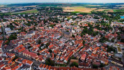 Aerial view around the old town of the city Alzey in Germany on a sunny spring noon