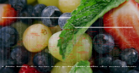 Showcasing green grapes blueberries strawberries and mint leaves in studio showing data overlays