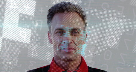 Overlaying digital graphics on mature man wearing red jacket in studio, with face recognition frame