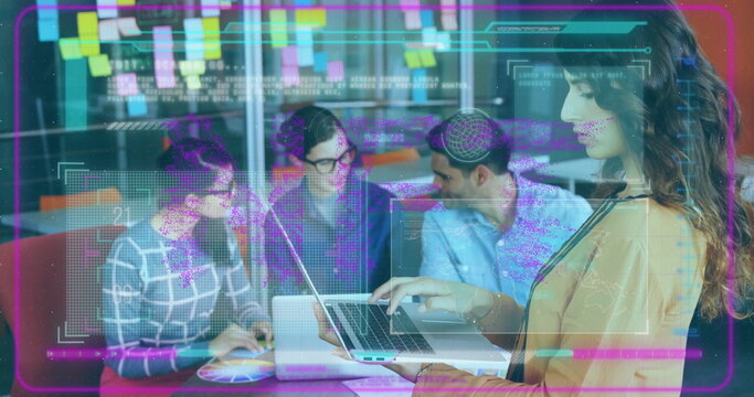 Standing woman in mustard blazer reviewing laptop in office lounge, with sticky notes, copy space