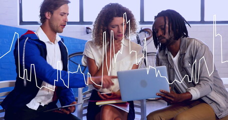 Collaborating professionals analyzing chart graphic in office lounge, with tablet laptop smartphone