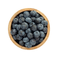 Blueberry berries isolated on a white background in a wooden plate, top view