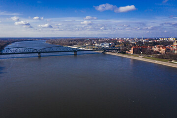 Drone view on the River Vistula and Jozef Pilsudski bridge in Torun city in Poland