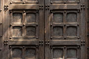 Wooden door with ancient square patten