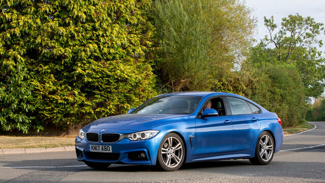 Whittlebury,Norhants,UK - Aug 23rd 2025: 2017 blue BMW 420d Gran Coupe m sport  car driving on a British road