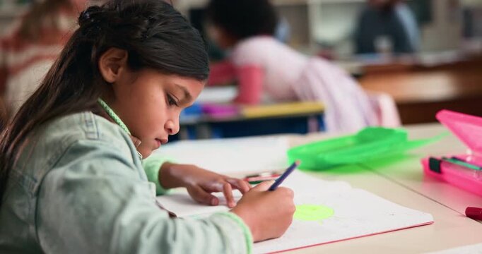 Education, drawing and child in classroom at school for test, assessment or project for learning. Color pencil, student and girl kid with notebook for writing with creative assignment at campus.