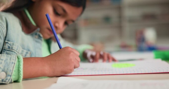 Education, writing and child in classroom at school for test, assessment or project for learning. Color pencil, student and girl kid with notebook for drawing with creative assignment at campus.