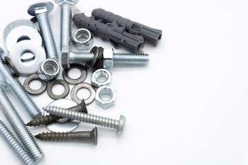 Set of screws of different types, allen, grade 5, hexagonal millimeter, eye bolts, washers, dowel, car screw, clamps on white background copy space	