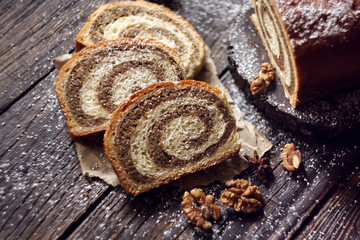 Walnut roll on a wooden background. Croatian orehnjaca