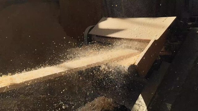 Woodworking, carpentry and the manufacturing process at the craftsman's. The process of milling or planing wood from scattered particles