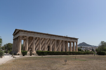 Obraz premium Temple of Hephaestus ancient Greek architecture Athens. Panoramic view of the Temple of Hephaestus in Athens Greece with surrounding landscape.