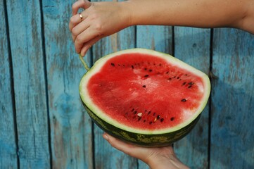sliced red watermelon on blue backdrop