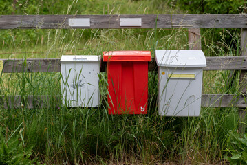 Various colorful roadside mailboxes in rural Sweden