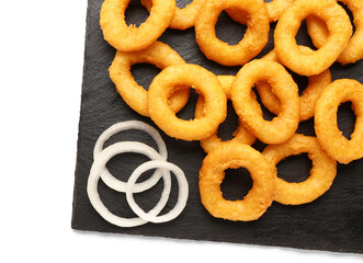 Black board with fried breaded onion rings on white background