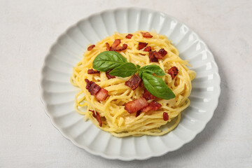 Plate with tasty pasta carbonara on white background