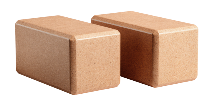Two light beige yoga blocks, side view