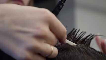 Woman Barber making customer Fashionable haircut in Modern style barbershop. Male hair cutting with scissors close up. Bearded Man client visit gentleman grooming beauty salon for hairstyle care