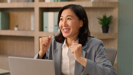 Happy Asian woman girl ethnic Korean businesswoman Japanese excited Chinese female business...