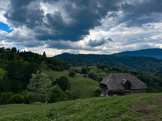 Wooden cabin in mountainous landscape