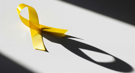 Yellow ribbon casting meaningful shadow creating artistic mental health awareness display