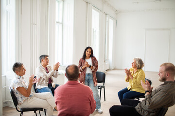 Diverse group of people having a group therapy session
