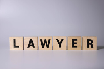 wooden kib and gavel with the word lawyer. the concept of a lawyer or court.