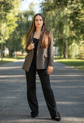 Business style. Full-length portrait of a young beautiful woman