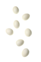 Flying many boiled chicken eggs on white background