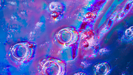 Abstract rainbow bokeh lights, colorful holographic blur on dark background, vibrant glowing texture