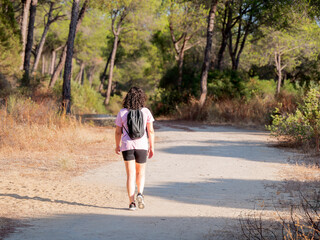 Woman walking on a quiet nature trail