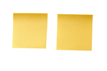 Two blank gold sticky notes against black background