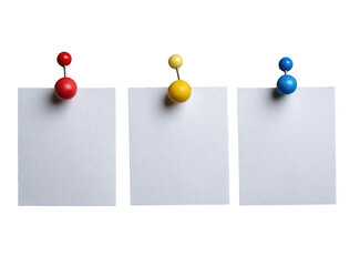 Three blank white sticky notes, each pinned with a colored pushpin