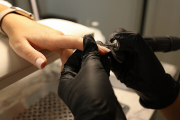 Nail designers manicure customers nails.