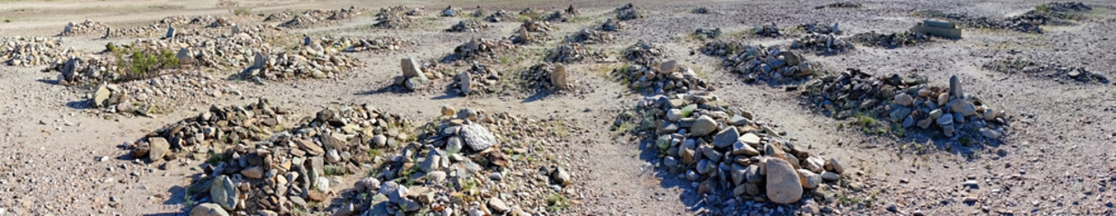 Desert Cemetery - Mounds of desert rock mark the burial places
