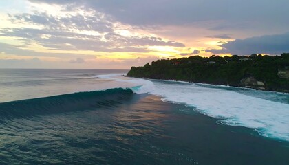 Dramatic sunset over a powerful ocean wave