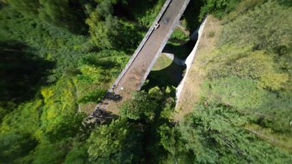 old bridge drone fpv shot - Powered by Adobe