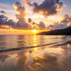 Obraz premium A golden sunset paints the tranquil beach scene, showcasing the interplay of light on the water and sand.