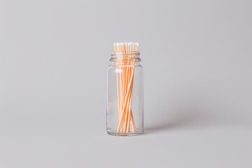 Neatly arranged cotton buds in jar high resolution picture