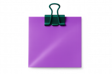 Green binder clip securing purple sticky note on transparent surface, representing minimalist workspace communication tool with blank space for writing
