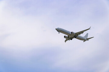 Passenger airplane flying in the sky during landing approach