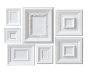 A collection of various sized, ornate, white picture frames arranged in a group
