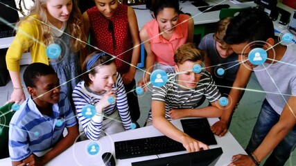 Boy tapping keyboard triggers animated network icons filling classroom lab as students collaborate - Powered by Adobe