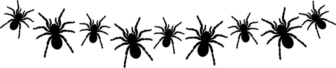 a bunch of spiders for Halloween window decoration